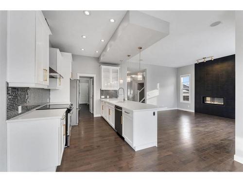 3 Sage Berry Rd Nw, Calgary, AB - Indoor Photo Showing Kitchen With Fireplace