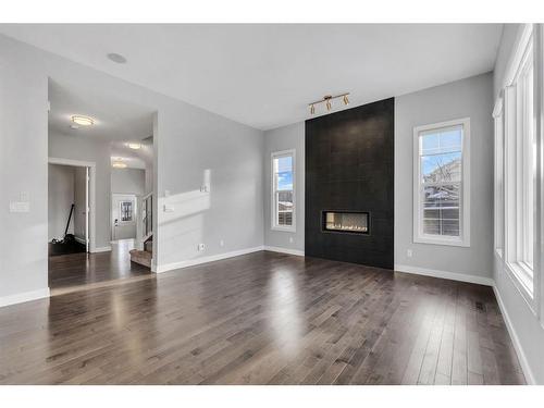 3 Sage Berry Rd Nw, Calgary, AB - Indoor Photo Showing Living Room With Fireplace