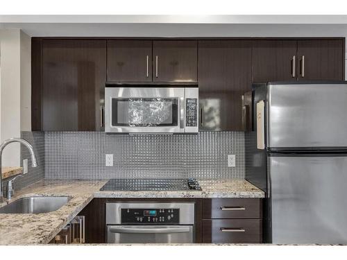 309-515 22 Avenue Sw, Calgary, AB - Indoor Photo Showing Kitchen With Stainless Steel Kitchen With Upgraded Kitchen