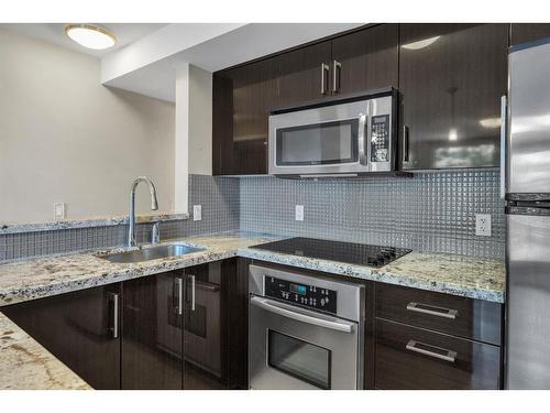 309-515 22 Avenue Sw, Calgary, AB - Indoor Photo Showing Kitchen With Stainless Steel Kitchen With Upgraded Kitchen