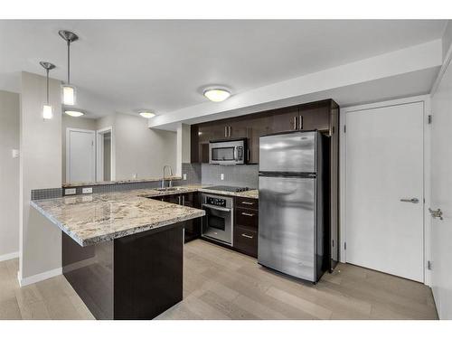 309-515 22 Avenue Sw, Calgary, AB - Indoor Photo Showing Kitchen With Stainless Steel Kitchen