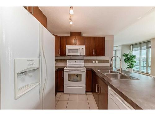 710-210 15 Avenue Se, Calgary, AB - Indoor Photo Showing Kitchen With Double Sink