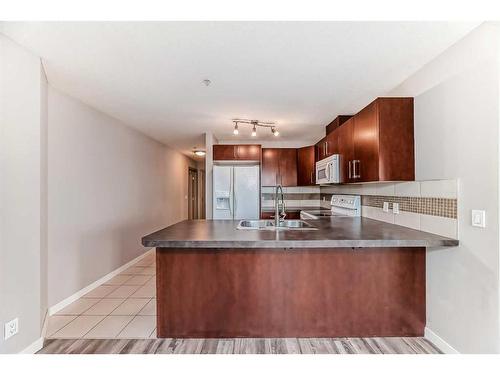 710-210 15 Avenue Se, Calgary, AB - Indoor Photo Showing Kitchen With Double Sink