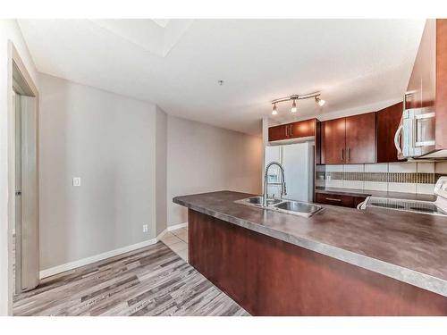 710-210 15 Avenue Se, Calgary, AB - Indoor Photo Showing Kitchen With Double Sink