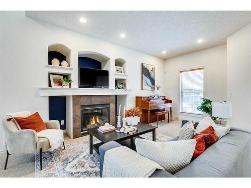 55 Bridlerange Circle Sw, Calgary, AB - Indoor Photo Showing Living Room With Fireplace