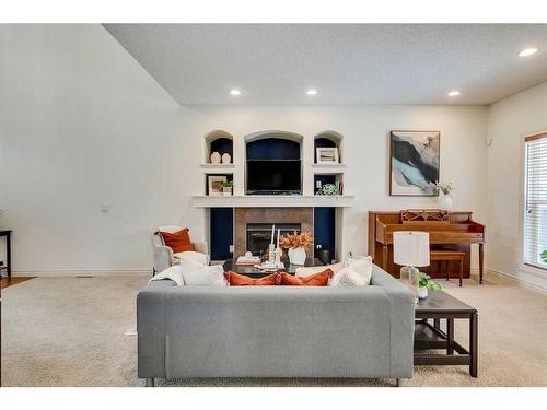 55 Bridlerange Circle Sw, Calgary, AB - Indoor Photo Showing Living Room With Fireplace