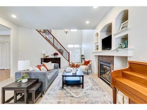 55 Bridlerange Circle Sw, Calgary, AB - Indoor Photo Showing Living Room With Fireplace