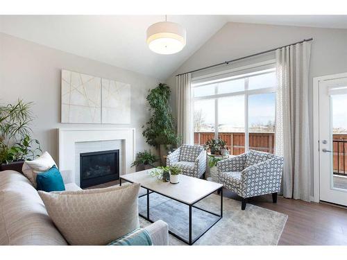 110-55 Fireside Circle, Cochrane, AB - Indoor Photo Showing Living Room With Fireplace