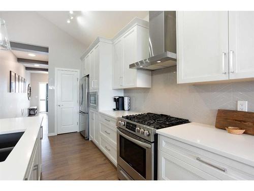 110-55 Fireside Circle, Cochrane, AB - Indoor Photo Showing Kitchen With Stainless Steel Kitchen With Upgraded Kitchen