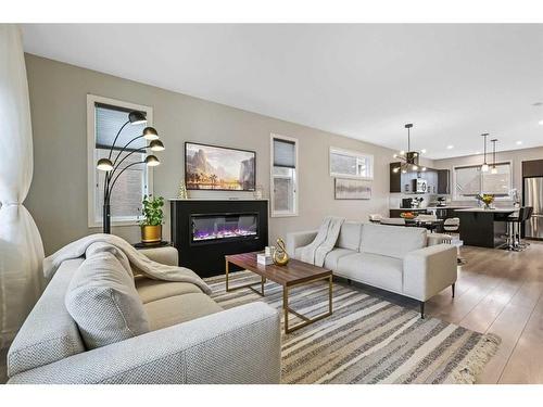 99 Masters Manor Se, Calgary, AB - Indoor Photo Showing Living Room With Fireplace