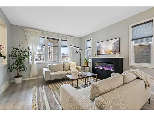 99 Masters Manor Se, Calgary, AB - Indoor Photo Showing Living Room With Fireplace