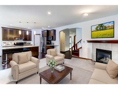 217 Elgin Manor Se, Calgary, AB - Indoor Photo Showing Living Room With Fireplace