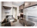 103-733 14 Avenue Sw, Calgary, AB  - Indoor Photo Showing Kitchen With Stainless Steel Kitchen 