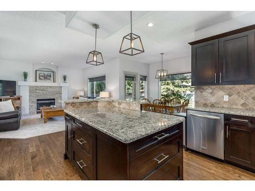 94 Tuscany Ridge Close Nw, Calgary, AB - Indoor Photo Showing Kitchen With Fireplace