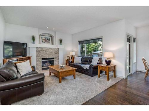 94 Tuscany Ridge Close Nw, Calgary, AB - Indoor Photo Showing Living Room With Fireplace