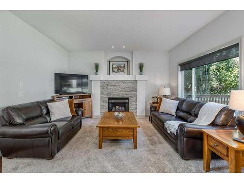 94 Tuscany Ridge Close Nw, Calgary, AB - Indoor Photo Showing Living Room With Fireplace