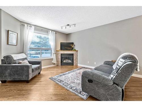 158 Mt Aberdeen Manor Se, Calgary, AB - Indoor Photo Showing Living Room With Fireplace