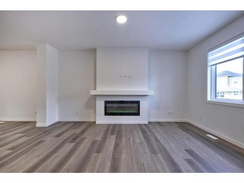 97 Legacy Reach Circle Se, Calgary, AB - Indoor Photo Showing Living Room With Fireplace