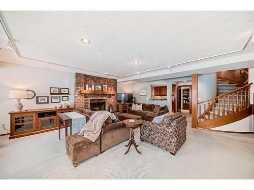 99 Hampshire Close Nw, Calgary, AB - Indoor With Fireplace