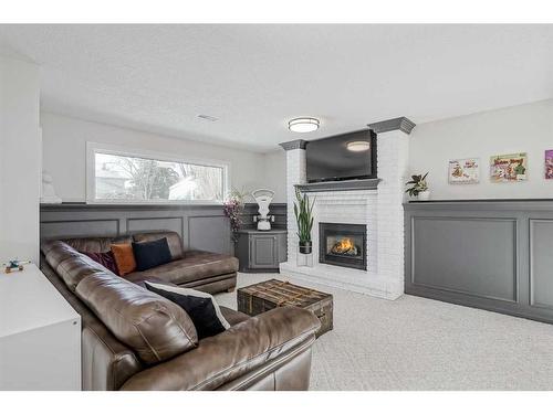 8460 61 Avenue Nw, Calgary, AB - Indoor Photo Showing Living Room With Fireplace