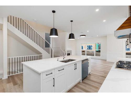 710 Mandalay Boulevard, Carstairs, AB - Indoor Photo Showing Kitchen With Double Sink