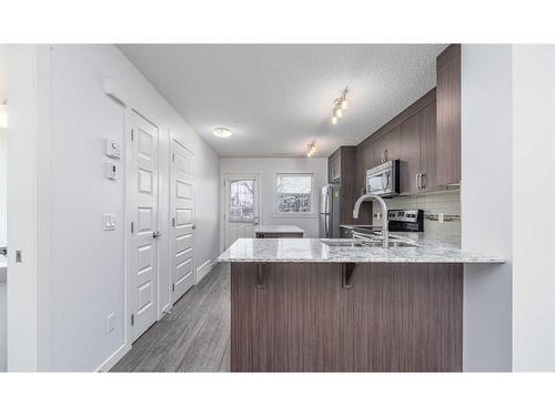 111 Auburn Bay Street Se, Calgary, AB - Indoor Photo Showing Kitchen With Double Sink With Upgraded Kitchen