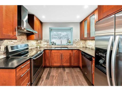 27 Deermoss Bay Se, Calgary, AB - Indoor Photo Showing Kitchen With Stainless Steel Kitchen With Double Sink