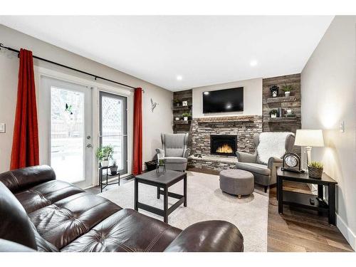 27 Deermoss Bay Se, Calgary, AB - Indoor Photo Showing Living Room With Fireplace