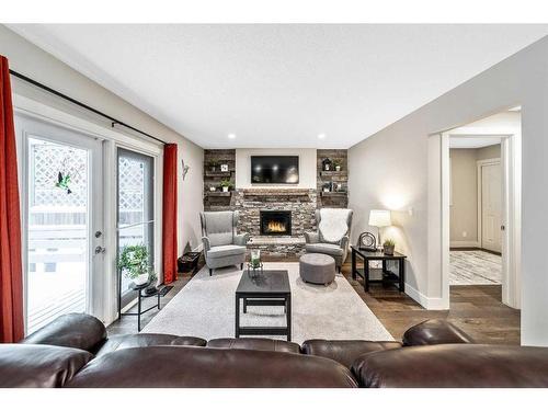 27 Deermoss Bay Se, Calgary, AB - Indoor Photo Showing Living Room With Fireplace