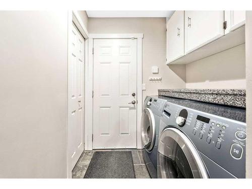 27 Deermoss Bay Se, Calgary, AB - Indoor Photo Showing Laundry Room