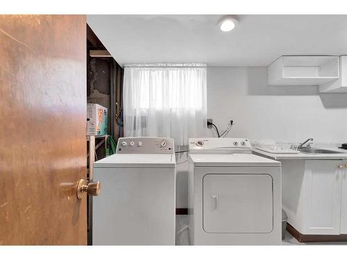 110 Hunterbrook Place Nw, Calgary, AB - Indoor Photo Showing Laundry Room