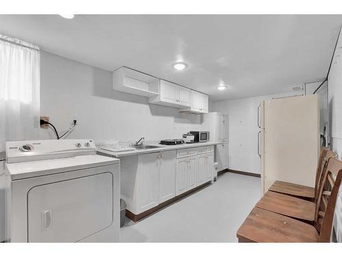 110 Hunterbrook Place Nw, Calgary, AB - Indoor Photo Showing Laundry Room