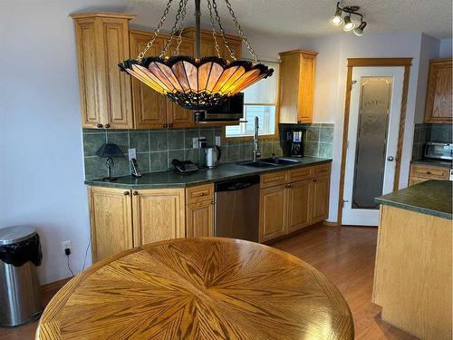 166 Cimarron Park Circle, Okotoks, AB - Indoor Photo Showing Kitchen With Double Sink