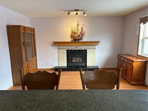 166 Cimarron Park Circle, Okotoks, AB - Indoor With Fireplace