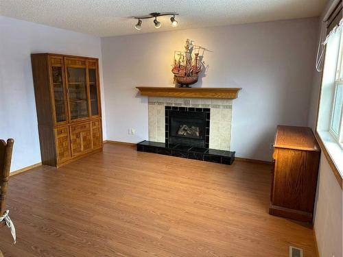 166 Cimarron Park Circle, Okotoks, AB - Indoor Photo Showing Living Room With Fireplace