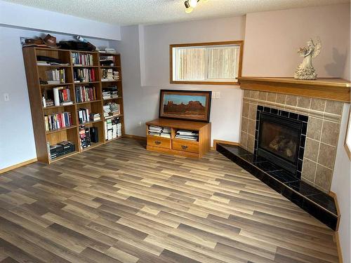 166 Cimarron Park Circle, Okotoks, AB - Indoor With Fireplace