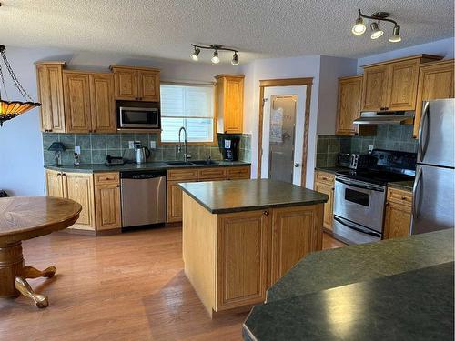 166 Cimarron Park Circle, Okotoks, AB - Indoor Photo Showing Kitchen With Double Sink