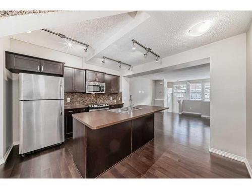 159 Auburn Bay Common Se, Calgary, AB - Indoor Photo Showing Kitchen With Double Sink