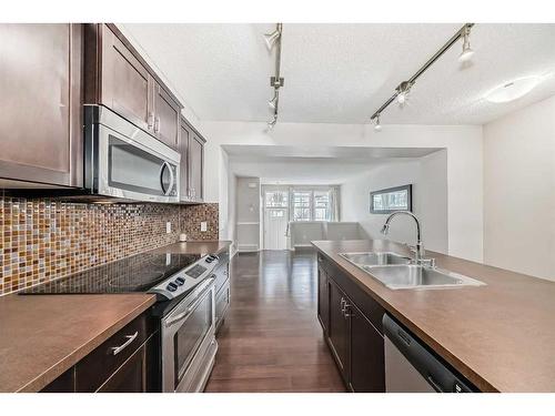 159 Auburn Bay Common Se, Calgary, AB - Indoor Photo Showing Kitchen With Double Sink