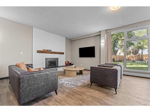 378-1620 8 Avenue Nw, Calgary, AB - Indoor Photo Showing Living Room With Fireplace