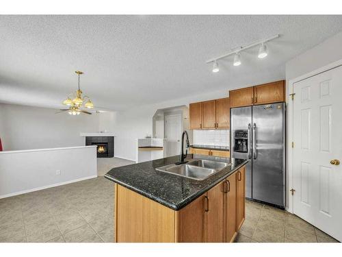 256 Oakmere Place, Chestermere, AB - Indoor Photo Showing Kitchen With Double Sink