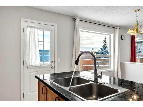 256 Oakmere Place, Chestermere, AB - Indoor Photo Showing Kitchen With Double Sink