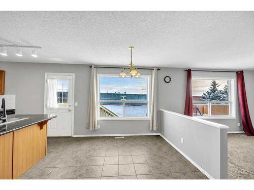 256 Oakmere Place, Chestermere, AB - Indoor Photo Showing Kitchen With Double Sink