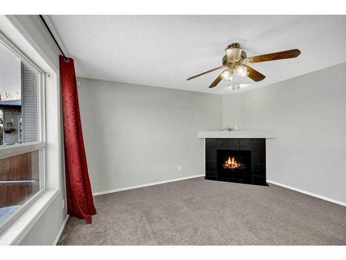 256 Oakmere Place, Chestermere, AB - Indoor With Fireplace