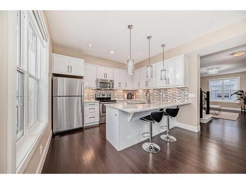 4 Quarry Lane Se, Calgary, AB - Indoor Photo Showing Kitchen With Stainless Steel Kitchen With Upgraded Kitchen