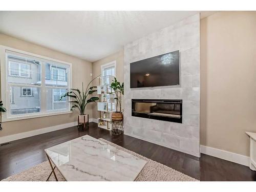 4 Quarry Lane Se, Calgary, AB - Indoor Photo Showing Other Room With Fireplace