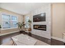 4 Quarry Lane Se, Calgary, AB  - Indoor Photo Showing Other Room With Fireplace 