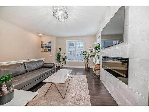 4 Quarry Lane Se, Calgary, AB - Indoor Photo Showing Living Room With Fireplace