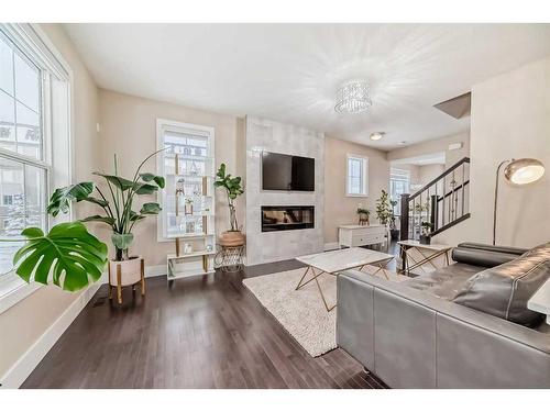 4 Quarry Lane Se, Calgary, AB - Indoor Photo Showing Other Room With Fireplace