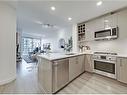 403-301 10 Street Nw, Calgary, AB  - Indoor Photo Showing Kitchen With Double Sink With Upgraded Kitchen 